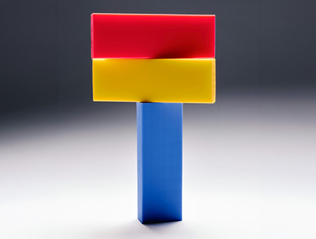 A vertical block with two blocks stacked on top of it. 