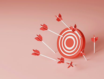 Several arrows landing around a target, all missing the bullseye.