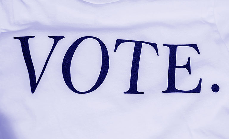 A crumpled paper with VOTE. on it.