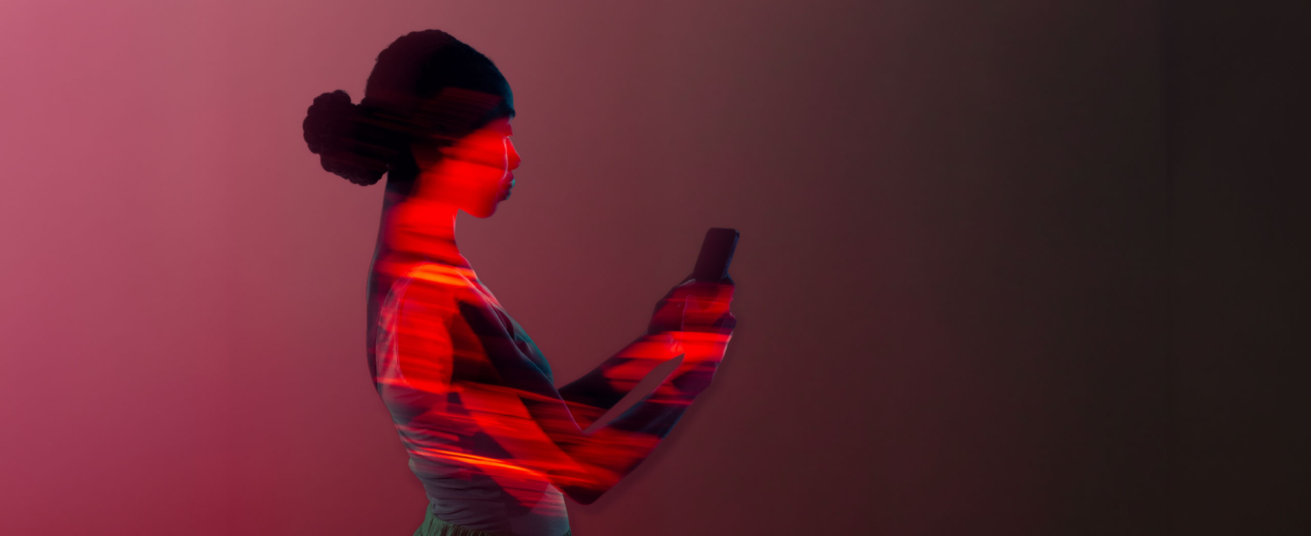 A woman looking at her smart phone.