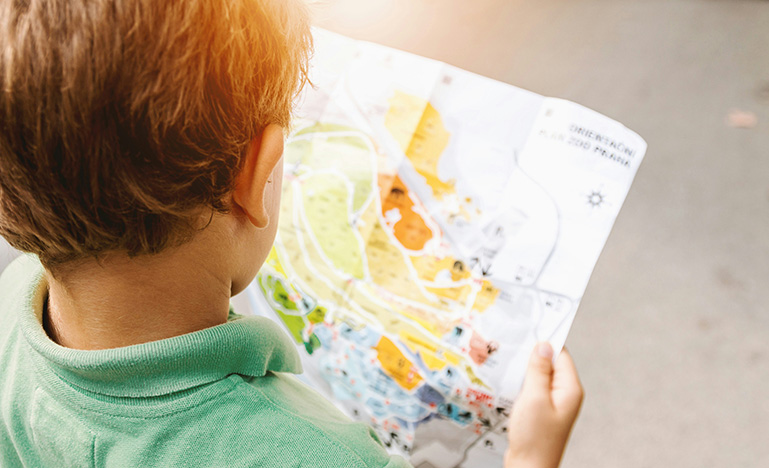 A child holding a map