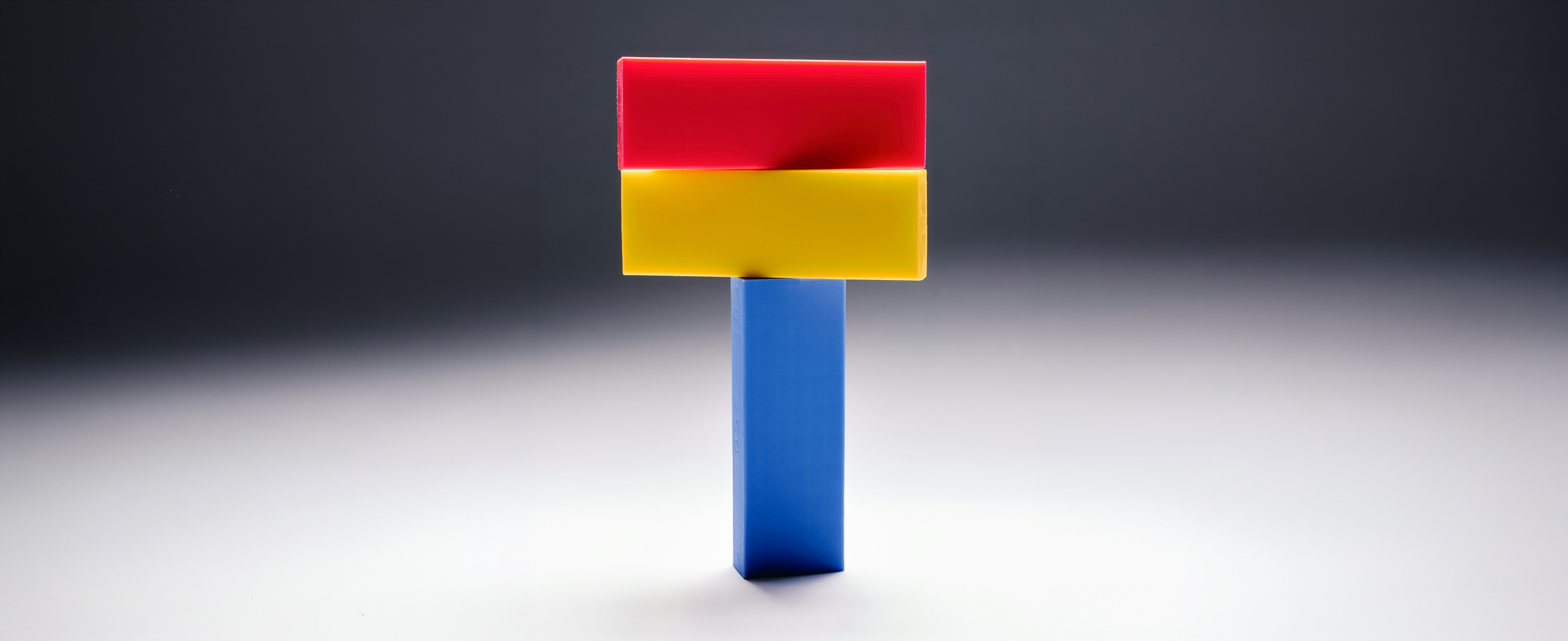 A vertical block with two blocks stacked on top of it. 