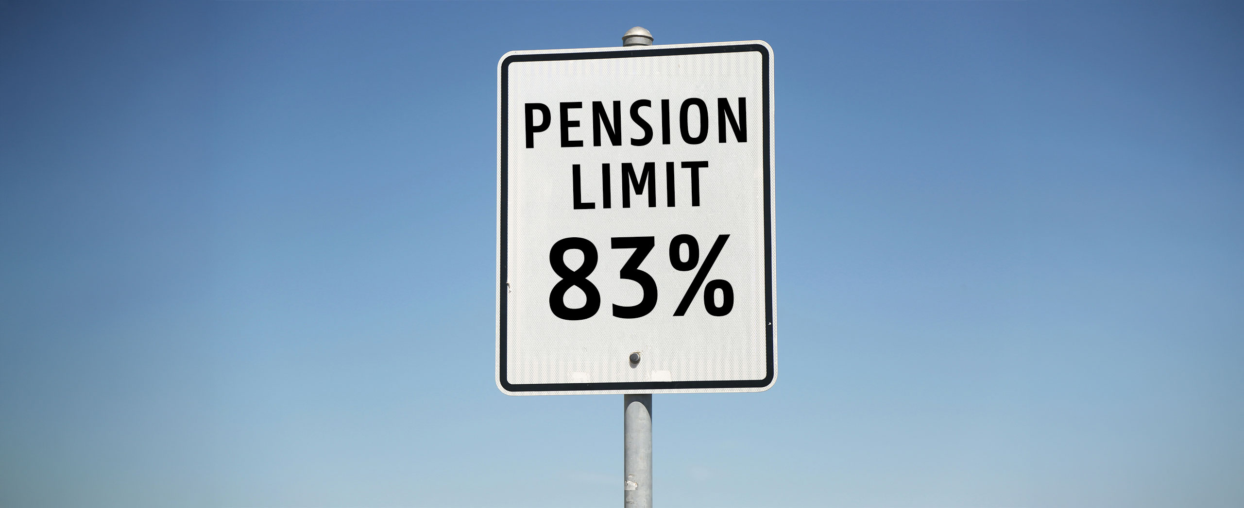A road sign that reads "Pension Limit 83%"