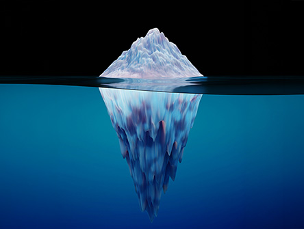 Cross-section view of an iceberg floating in the ocean. 