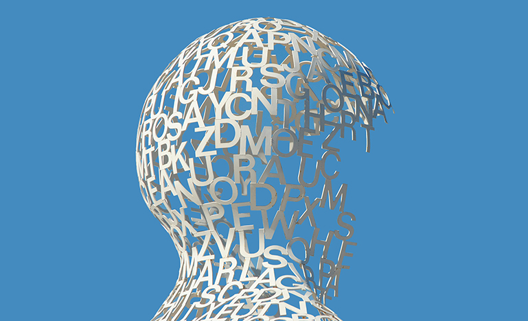 A sculpture of an unfinished human head comprised only of letters.