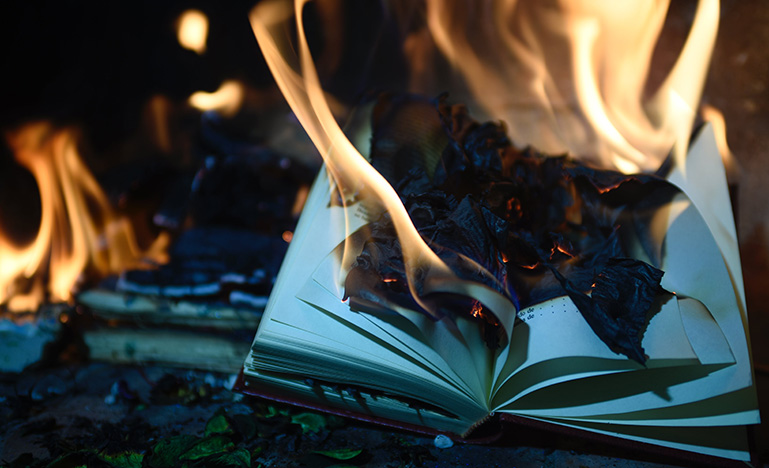 A book engulfed in flames.