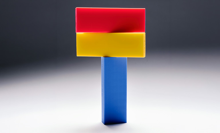 A vertical block with two blocks stacked on top of it. 